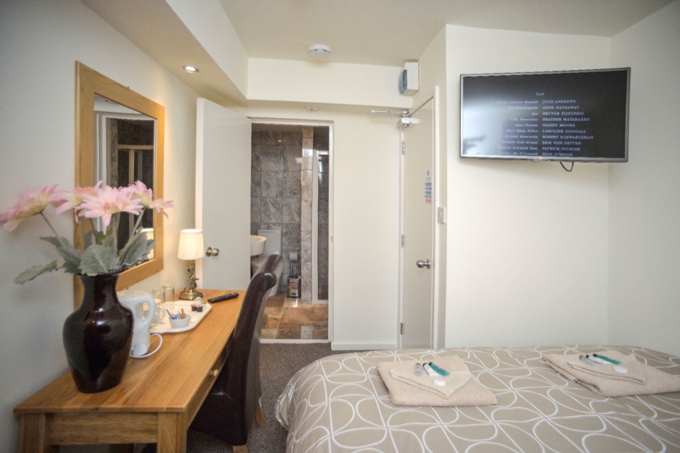Wide view of the newly designed double room with seating area